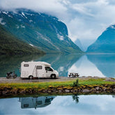 Outdoor campfire scene next to an RV, representing off-grid boondocking powered by efficient solar energy solutions